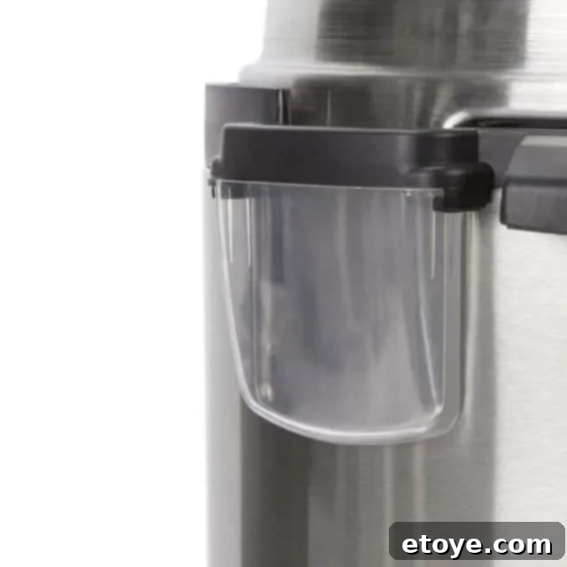 Bella Pressure Cooker Review and Giveaway 5 User demonstrating the easy-to-operate lid of the Bella Pressure Cooker, highlighting the cool-touch handle for safe handling.