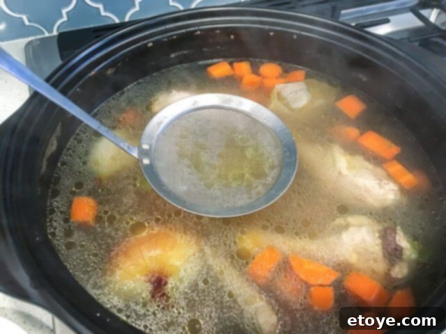 Effortless Degreasing: My Go-To for Stocks and Sauces 4 best way skim oil-0959, demonstrating a large amount of removed fat