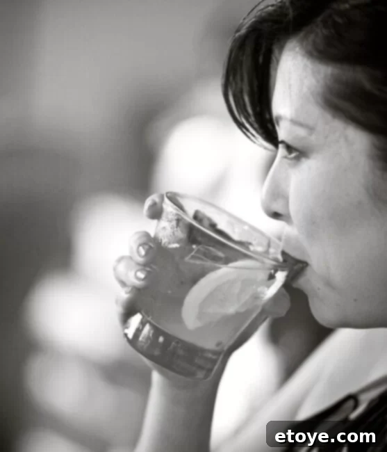 Preparing the Xanadu Cocktail, muddling basil leaves for enhanced flavor