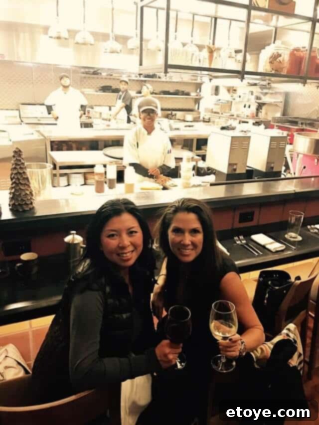 A plate of fresh raw oysters with a backdrop of a culinary event, emphasizing the pure taste of seafood.