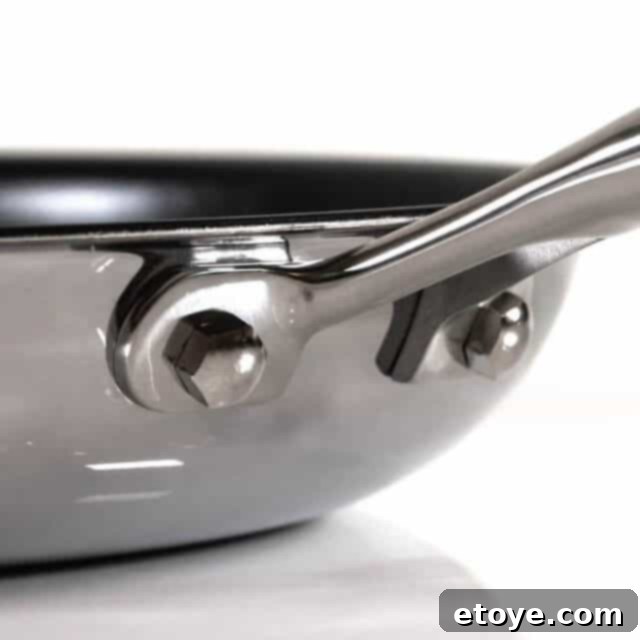 Close-up view of the Frieling Black Cube Wok's interior after cooking, showing food residue in crevices