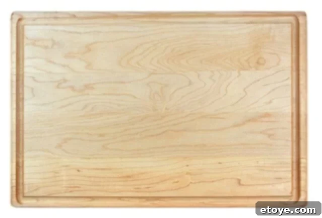 Edge grain cutting board, demonstrating horizontal wood strips fused together for a robust surface.