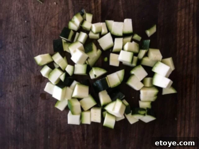 Diced zucchini, cut into uniform 1/2-inch pieces for stir-frying.