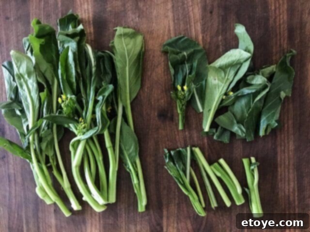 Fresh yu-choy, with stems separated from leaves, demonstrating ideal preparation for stir-frying.