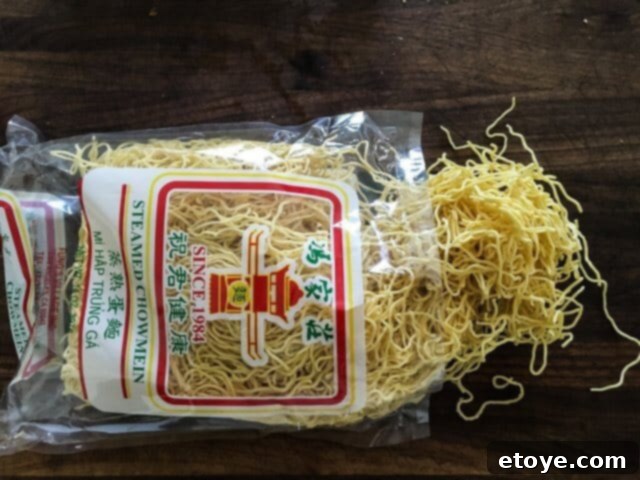 Fresh Chinese noodles in a bowl, ready to be prepared for stir-frying.