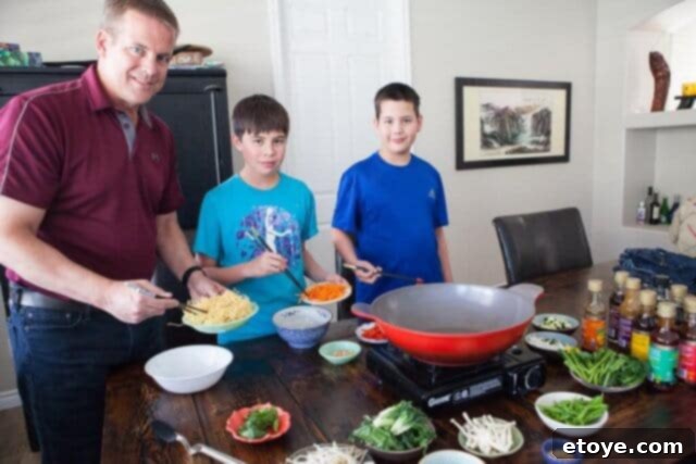 An inviting array of prepared ingredients, sauces, and cooking station, ready for a DIY Mongolian BBQ session.