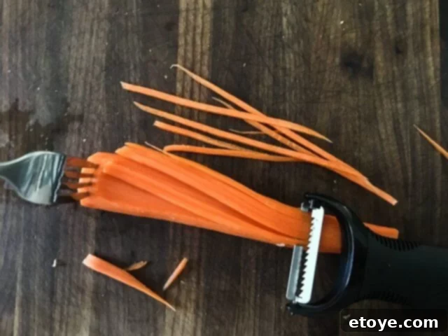 Finely julienned carrots, perfectly prepped for a quick stir-fry in Mongolian BBQ.