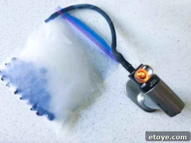 Delicious Smoked Olives Using a Smoking Gun 11 The resealable plastic bag is fully inflated with dense, white smoke, completely enveloping the olives inside.