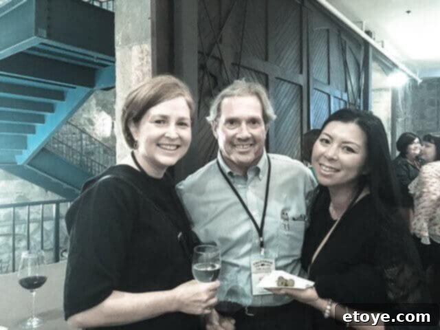 Delicious Smoked Olives Using a Smoking Gun 3 Elise, a knowledgeable olive grower named Mike Silveira, and the author smiling together in an olive grove, bathed in natural light.