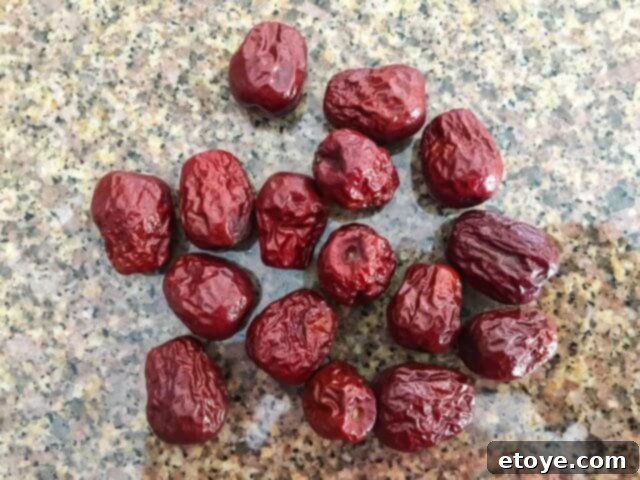 Exquisite Chinese Bird's Nest Soup 4 A close-up of dried red dates (jujubes), showing their wrinkled texture.