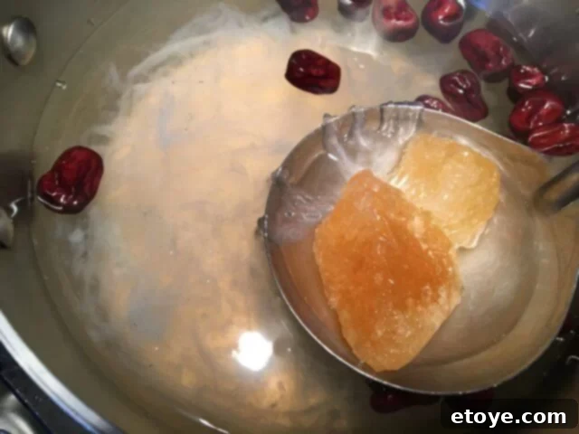 Exquisite Chinese Bird's Nest Soup 11 Rock sugar dissolving into the warm bird's nest soup.