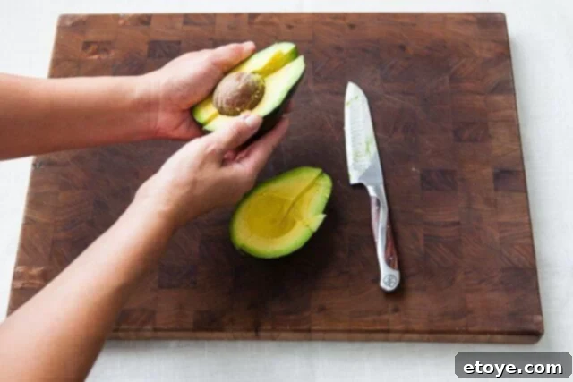 Grapefruit, Avocado and Baby Arugula Salad 15 Twisting avocado segment again