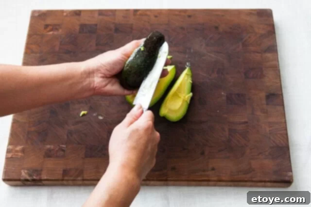 Grapefruit, Avocado and Baby Arugula Salad 17 Halving avocado segment if pit is stubborn