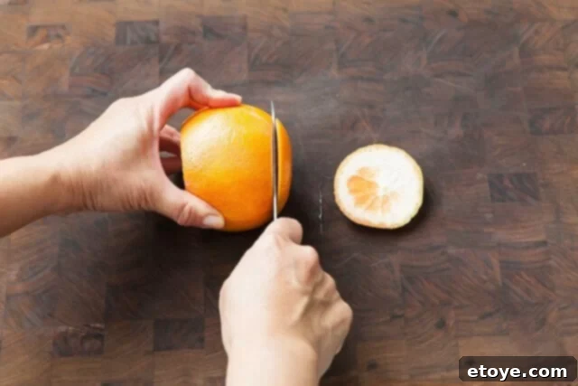 Grapefruit, Avocado and Baby Arugula Salad 3 Trimming top and bottom of grapefruit for supreming