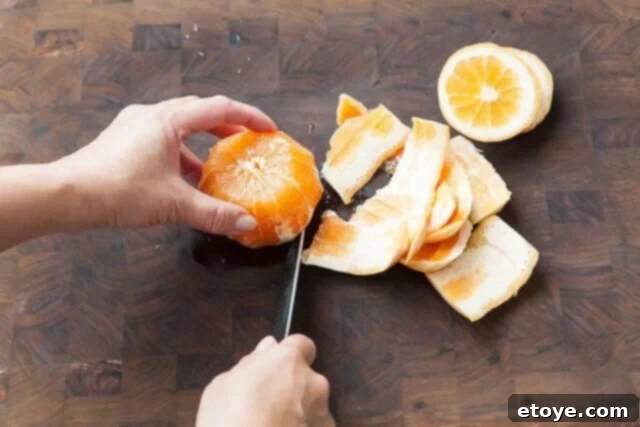 Grapefruit, Avocado and Baby Arugula Salad 5 Detailed view of removing grapefruit peel