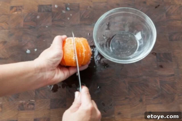 Grapefruit, Avocado and Baby Arugula Salad 7 Cutting grapefruit segment along membrane