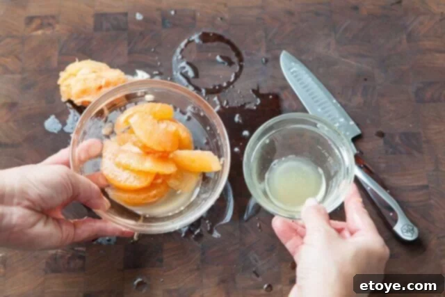 Grapefruit, Avocado and Baby Arugula Salad 9 Squeezing juice from grapefruit core
