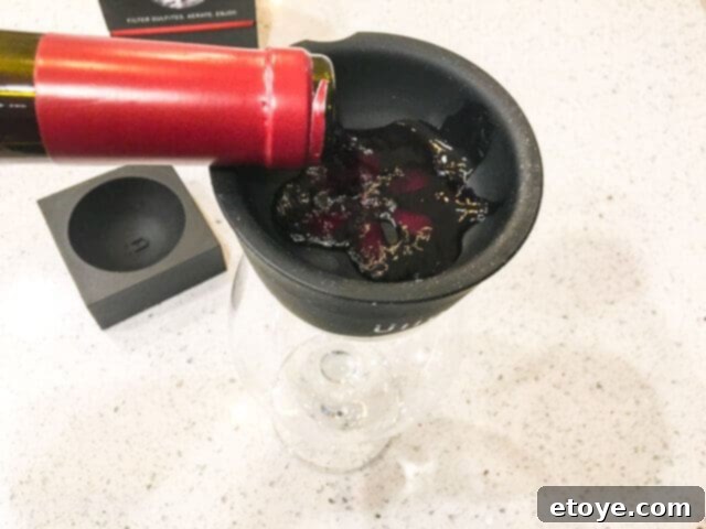 Wine Purifier Ends Hangovers and Headaches 11 Pouring wine into Ullo Wine Purifier