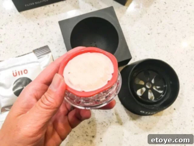 Wine Purifier Ends Hangovers and Headaches 8 Inserting Ullo Wine Purifier filter