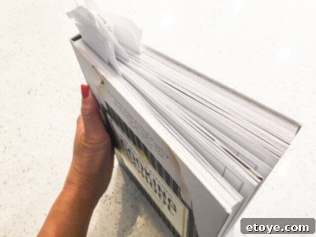 Book with numerous bookmarks highlighting pages