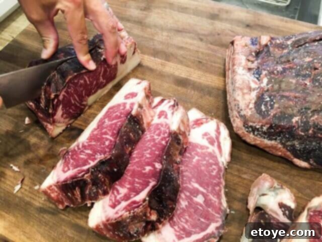 SteakAger Review Plus Win One 17 Several thick slices of dry-aged steak cut from the larger slab, with the trimmed bark beside them