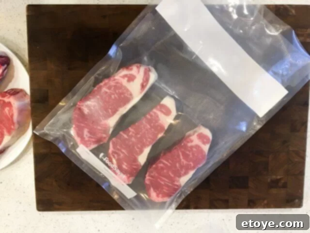 SteakAger Review Plus Win One 23 Dry-aged steaks placed in a vacuum sealable bag for sous vide cooking