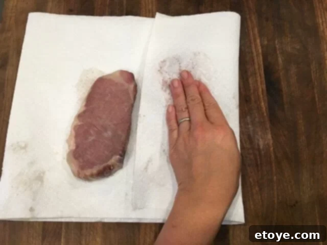 SteakAger Review Plus Win One 27 A steak being patted thoroughly dry with paper towels after sous vide cooking