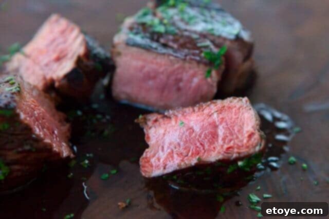 SteakAger Review Plus Win One 29 A perfectly seared, rested dry-aged steak topped with garlic herb butter, ready to be served