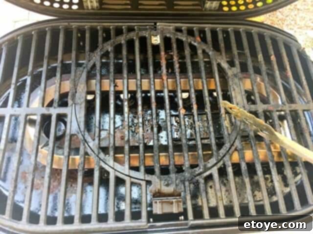 Cleaning the STOK Gridiron Grill's grates after cooking