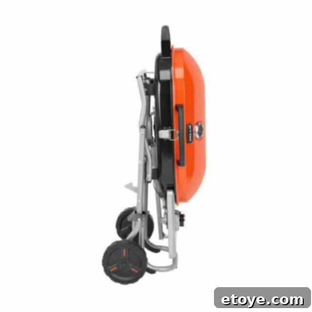 STOK Gridiron Grill with legs folded, showing its compact size for vehicle trunks