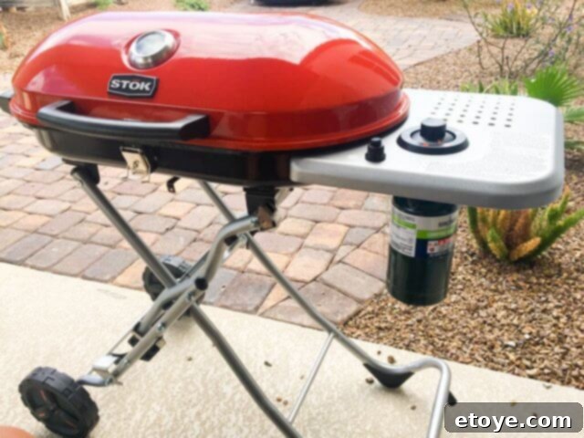 STOK Gridiron Grill fully extended to comfortable, full-height cooking position