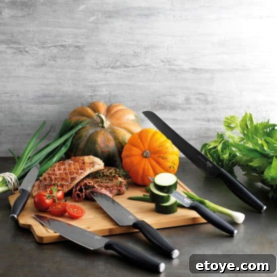 Kuhn Rikon Colori Titanium Knife Set displayed neatly on a kitchen counter, showcasing their sleek design.