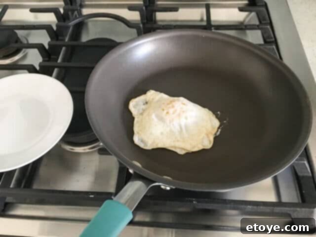 Win Rachael Ray Hard Anodized Cookware 11 Cooked egg sliding off Rachael Ray skillet