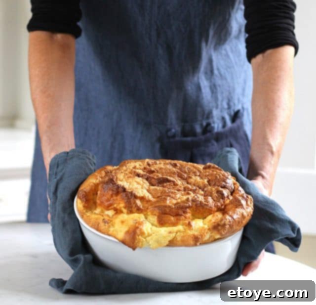 Thread & Whisk apron reviewer wearing the apron in a kitchen setting