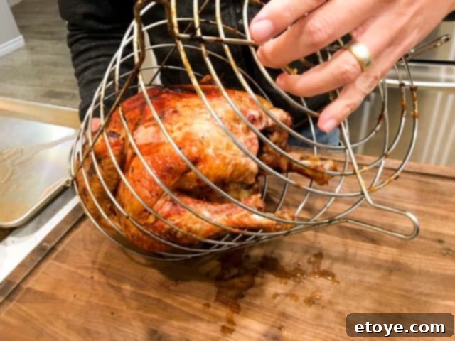 The effortless release of a perfectly cooked oil-less deep fried turkey. Deep fry turkey without oil - Char Boil big easy