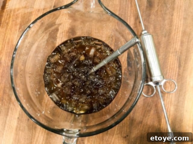 Injecting turkey for maximum juiciness in an oil-less fryer. Deep fried turkey without oil - inject