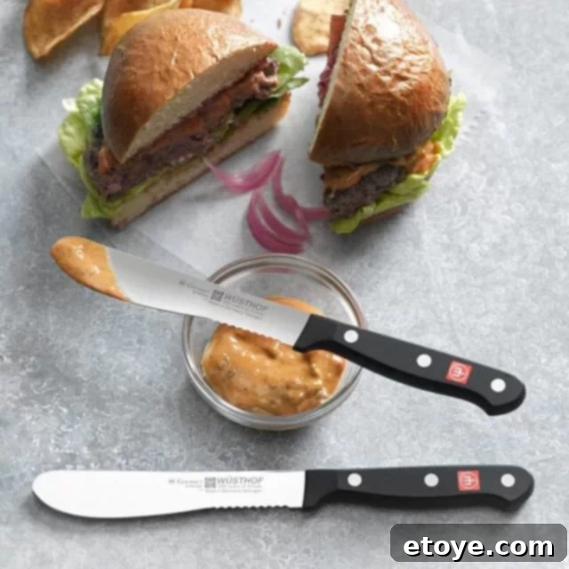 Wusthof Gourmet Burger Knife Set with a cooked burger ready to be cut.