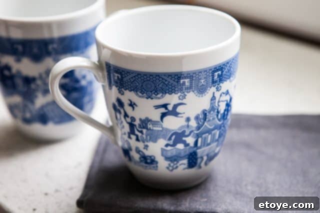 Close-up of various Calamityware mugs showcasing diverse creature designs and artistic details
