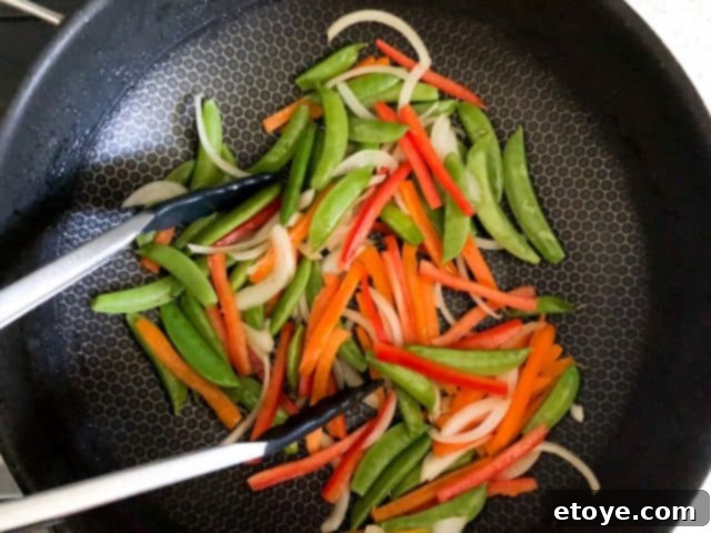 Shrimp Teriyaki Recipe stir fry vegetables Shrimp Teriyaki Recipe stir frying a medley of colorful vegetables