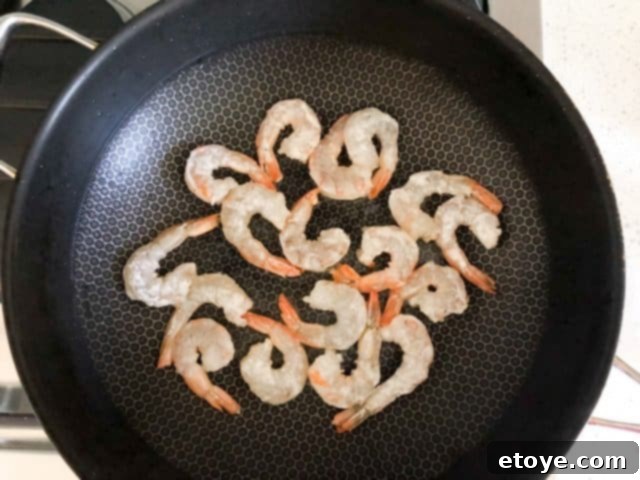 Shrimp Teriyaki Recipe stir fry shrimp Shrimp Teriyaki Recipe stir fry shrimp in a hot wok for caramelization