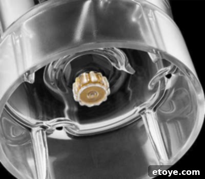 Elevate Your Kitchen Win a KitchenAid Blender 7 The Soft Start feature in action, showing ingredients being gently pulled into the blender blades.