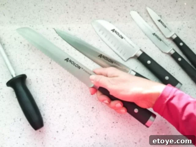 Anolon 17-Piece Japanese Knife Set Review Anolon 17-Piece Japanese Bread Knife slicing a loaf