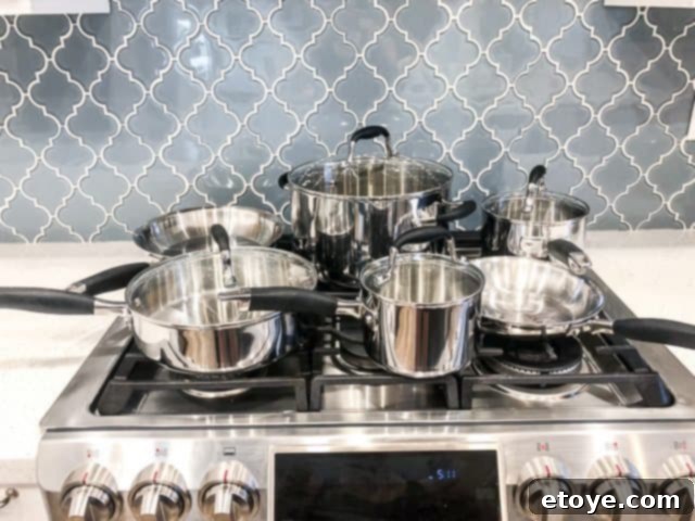 Anolon Advanced Tri-Ply Cookware review Anolon Advanced Tri-Ply Cookware Set displayed with various pieces including skillets and saucepans