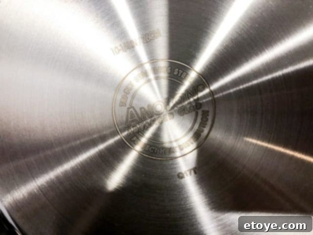 Anolon Advanced Tri-Ply Cookware review material Cross-section view illustrating the three layers of Anolon Advanced Tri-Ply Cookware material