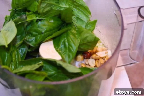 Food Processor Blending Pesto Ingredients