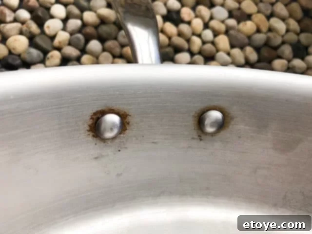 Traditional Wok Rivets vs. Hestan NanoBond Flush Rivets Traditional Wok Rivets vs. Hestan NanoBond Flush Rivets