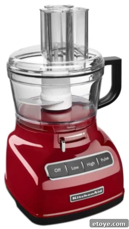 Elevate Your Kitchen: Win a KitchenAid 7-Cup EZ Store Food Processor 2 KitchenAid 7-Cup Food Processor in action, demonstrating its sleek design and compact size.