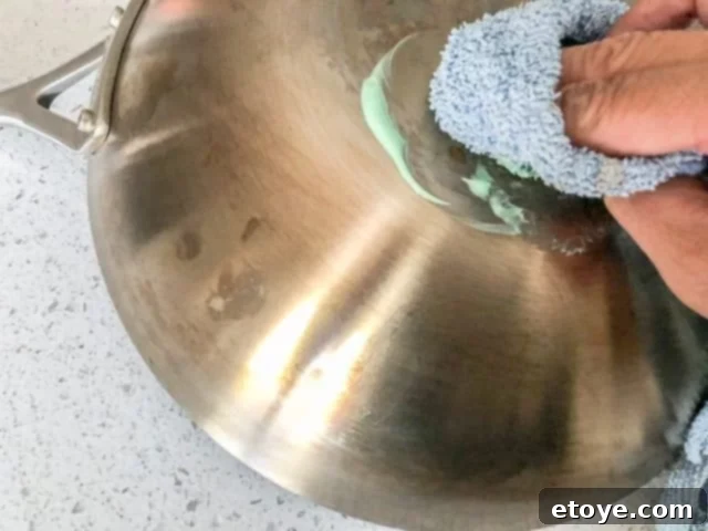 Scanpan CS+ Wok Review: Applying stainless steel cleaning paste