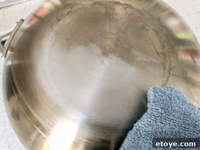 Scanpan CS+ Wok Review: Cleaning in progress with stainless steel paste