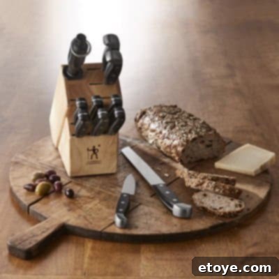 Win a Henkels 12-Piece Knife Block Set 3 Close-up detail of Henckels International knife blades and ergonomic handles, highlighting the triple-rivet design and satin finish